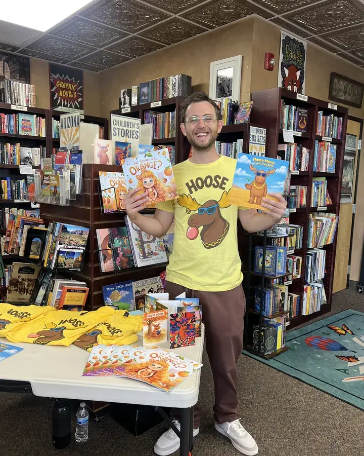 Mr B in a bookstore with his two picture books